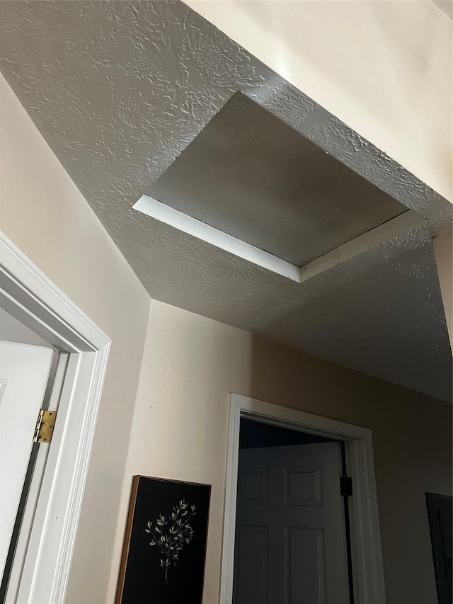interior details with a textured ceiling