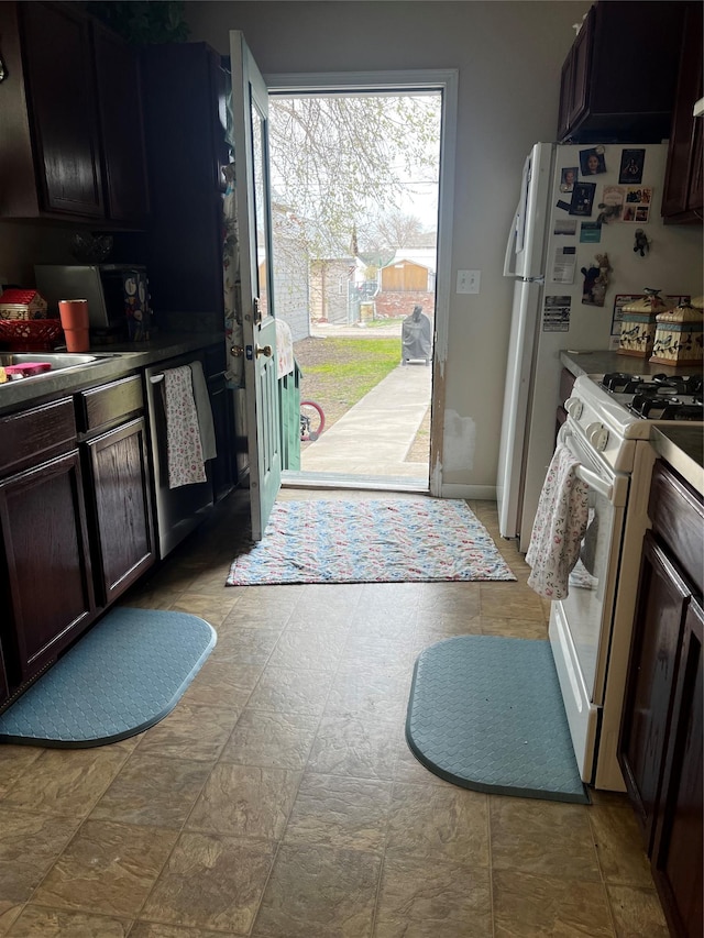 kitchen featuring dishwasher and white gas range