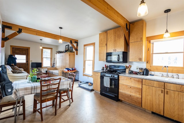 kitchen featuring beamed ceiling, black appliances, a sink, light countertops, and decorative backsplash