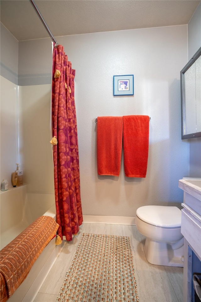 701 N Davis St Unit A, Helena, MT 59601 - full bathroom featuring vanity, shower / tub combo, and wood finished floors