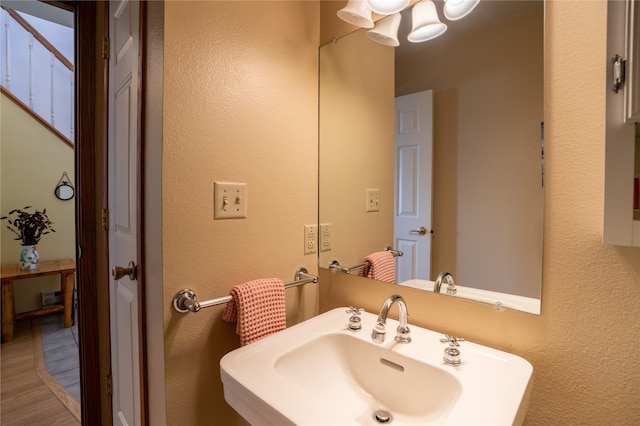 701 N Davis St Unit A, Helena, MT 59601 - bathroom with a textured wall and a chandelier