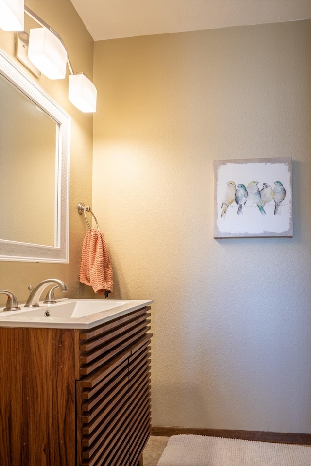 701 N Davis St Unit A, Helena, MT 59601 - bathroom with vanity and baseboards