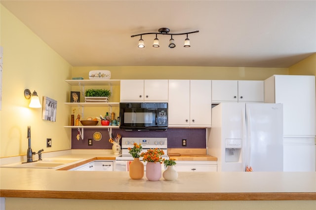 701 N Davis St Unit A, Helena, MT 59601 - kitchen with white appliances, light countertops, and white cabinetry