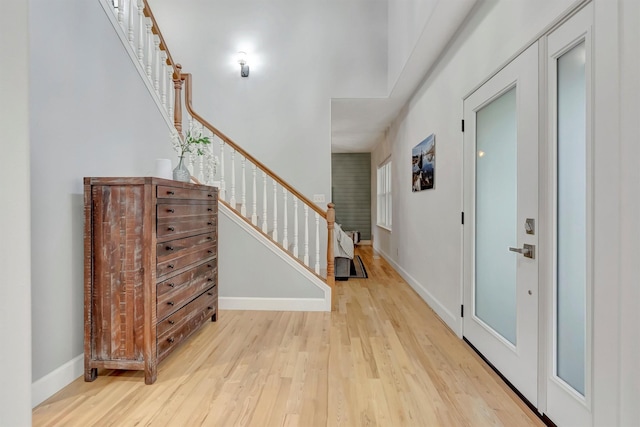 15022 Romulus Ln, Frenchtown, MT 59834 - entryway with light wood finished floors, stairway, and baseboards