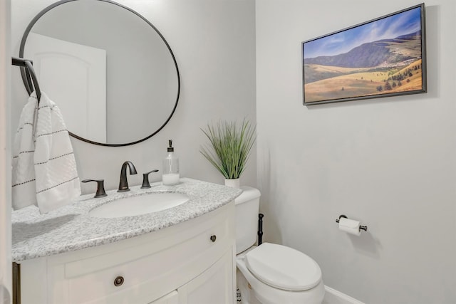 15022 Romulus Ln, Frenchtown, MT 59834 - bathroom featuring vanity, toilet, and baseboards