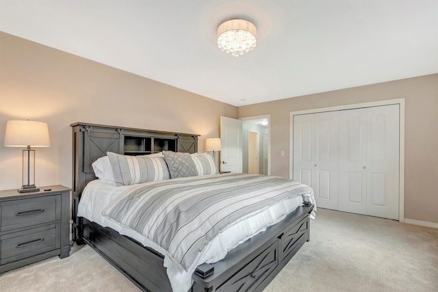 15022 Romulus Ln, Frenchtown, MT 59834 - bedroom featuring light colored carpet, a closet, baseboards, and a chandelier