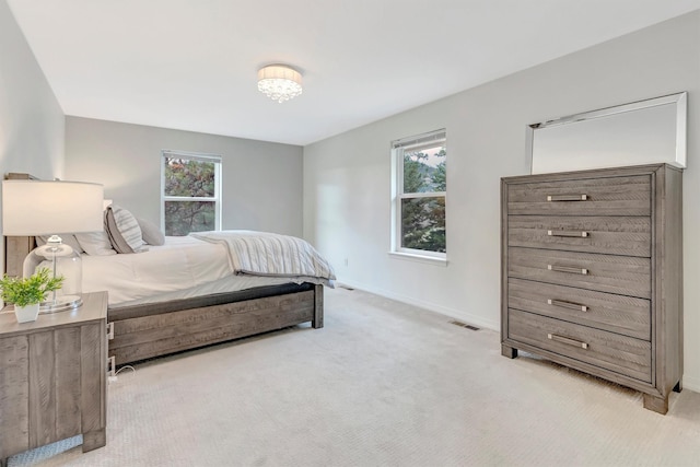 15022 Romulus Ln, Frenchtown, MT 59834 - bedroom with multiple windows, light colored carpet, and baseboards