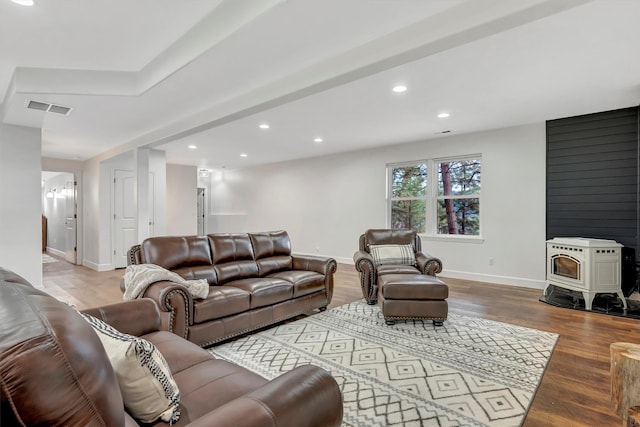 15022 Romulus Ln, Frenchtown, MT 59834 - living room featuring recessed lighting, wood finished floors, a wood stove, and baseboards