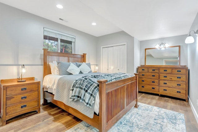 15022 Romulus Ln, Frenchtown, MT 59834 - bedroom with light wood-style flooring, a closet, recessed lighting, and baseboards