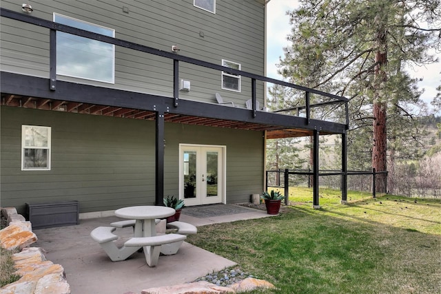15022 Romulus Ln, Frenchtown, MT 59834 - back of property with french doors, a yard, and a patio area