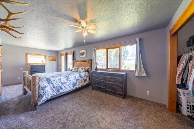 139 Highwood Dr, Libby, MT 59923 - bedroom featuring carpet flooring, a ceiling fan, and a textured ceiling