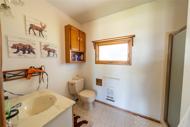139 Highwood Dr, Libby, MT 59923 - bathroom featuring toilet, vanity, an enclosed shower, heating unit, and baseboards