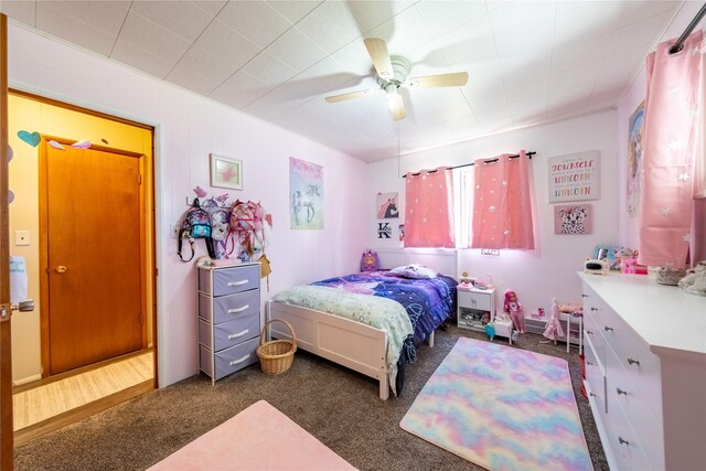 139 Highwood Dr, Libby, MT 59923 - bedroom with dark carpet and a ceiling fan
