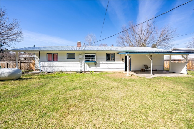 139 Highwood Dr, Libby, MT 59923 - rear view of property with a chimney, metal roof, and a patio