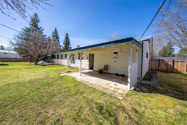 139 Highwood Dr, Libby, MT 59923 - back of house with a patio and a chimney