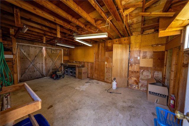 139 Highwood Dr, Libby, MT 59923 - garage featuring wood walls