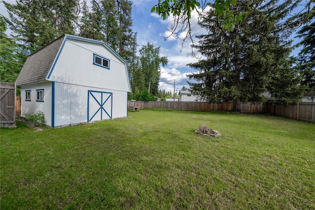 139 Highwood Dr, Libby, MT 59923 - fenced backyard featuring an outdoor structure and a barn