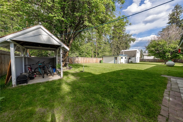139 Highwood Dr, Libby, MT 59923 - fenced backyard featuring a gazebo and an outbuilding