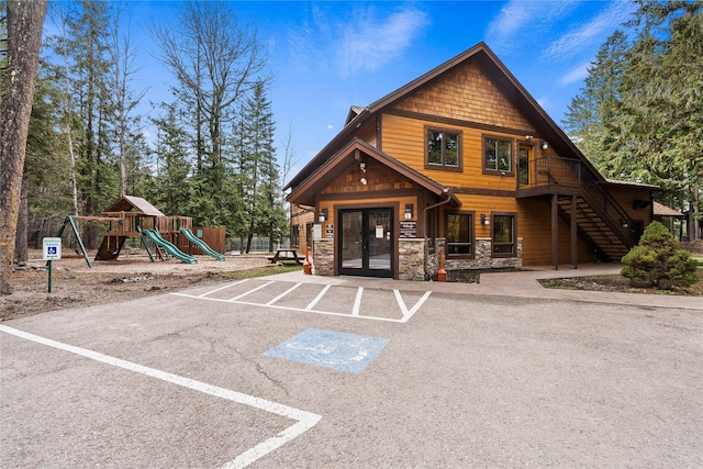 73 Limber Pne Unit 73, Whitefish, MT 59937 - view of building exterior featuring stairway and uncovered parking