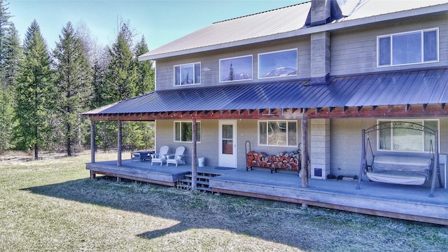 2 Trails End Dr, Heron, MT 59844 - back of house with metal roof, a wooden deck, and a yard