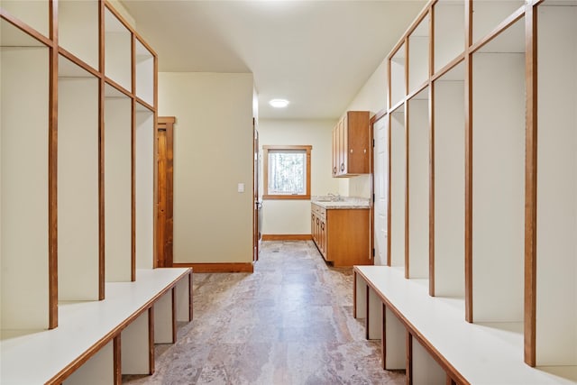 136 N Fork Trl, Columbia Falls, MT 59912 - mudroom with baseboards and a sink