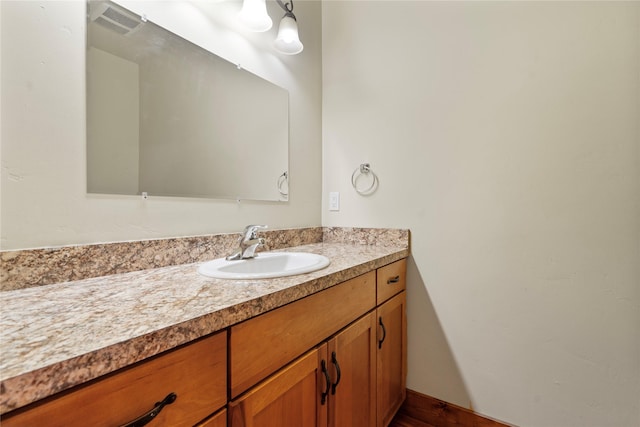 bathroom featuring vanity, wood finished floors, and visible vents