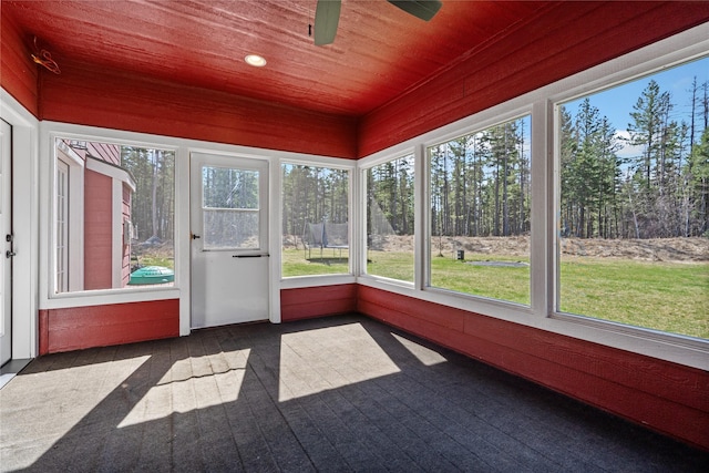 136 N Fork Trl, Columbia Falls, MT 59912 - unfurnished sunroom with wooden ceiling, ceiling fan, and carpet flooring