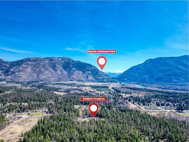 136 N Fork Trl, Columbia Falls, MT 59912 - view of mountain backdrop featuring a heavily wooded area
