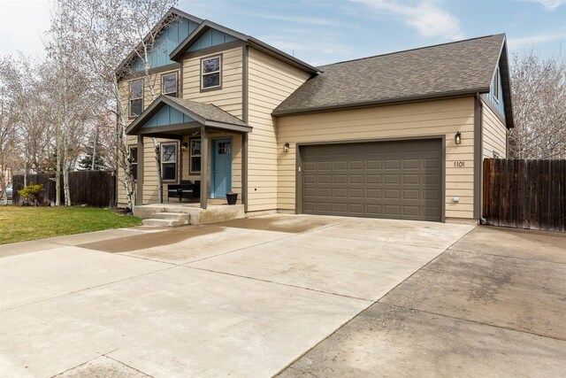 1101 E Gallatin Ave, Belgrade, MT 59714 - craftsman house featuring a shingled roof, driveway, a garage, and fence