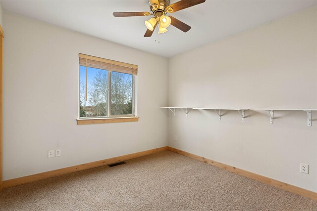 1101 E Gallatin Ave, Belgrade, MT 59714 - spare room featuring ceiling fan, visible vents, baseboards, and carpet floors