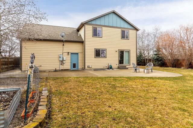 1101 E Gallatin Ave, Belgrade, MT 59714 - rear view of house with a yard, entry steps, fence, and a patio