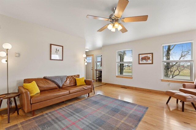 1101 E Gallatin Ave, Belgrade, MT 59714 - living area with wood-type flooring, baseboards, and a ceiling fan