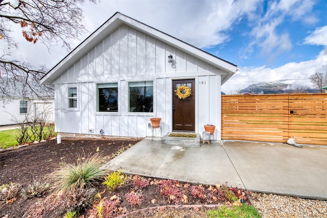 181 Ricketts Rd, Hamilton, MT 59840 - view of front of home featuring board and batten siding, fence, and a patio