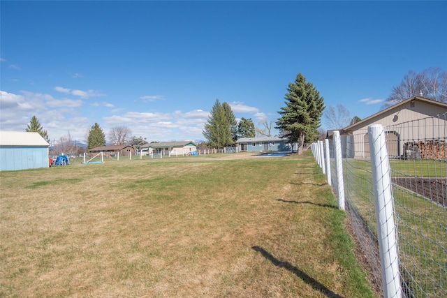 view of yard with fence