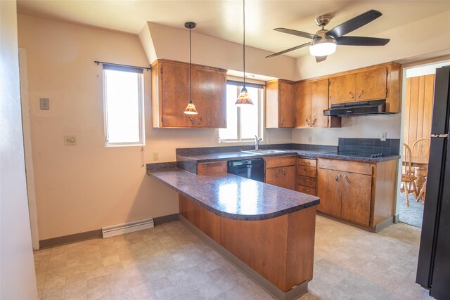 kitchen featuring a peninsula, under cabinet range hood, dark countertops, and black appliances