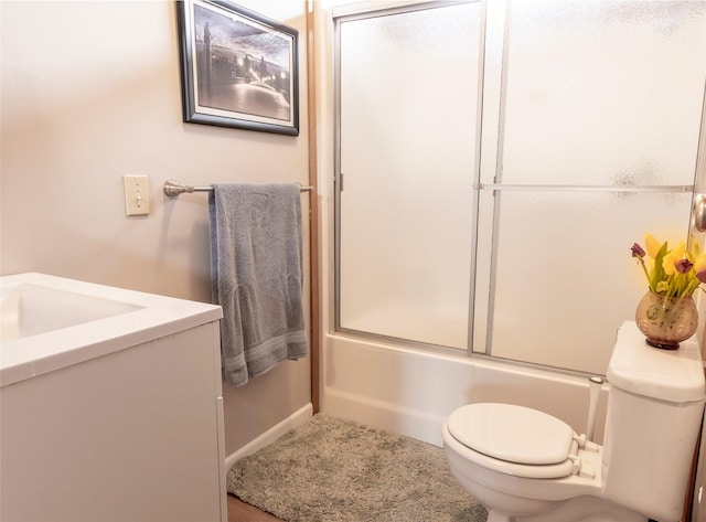 714 Rosalind St, Philipsburg, MT 59858 - bathroom featuring toilet, vanity, and combined bath / shower with glass door