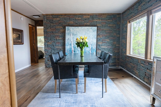 714 Rosalind St, Philipsburg, MT 59858 - dining space featuring wood finished floors, healthy amount of natural light, and baseboards