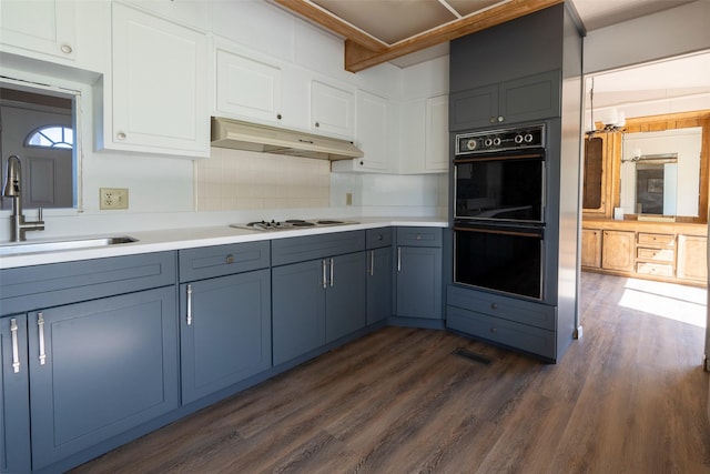714 Rosalind St, Philipsburg, MT 59858 - kitchen featuring under cabinet range hood, a sink, dark wood-style floors, light countertops, and white electric stovetop