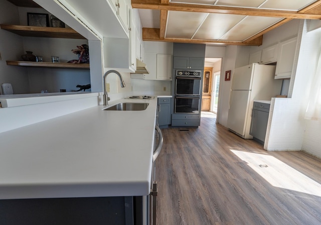 714 Rosalind St, Philipsburg, MT 59858 - kitchen featuring a sink, freestanding refrigerator, wood finished floors, light countertops, and gray cabinetry