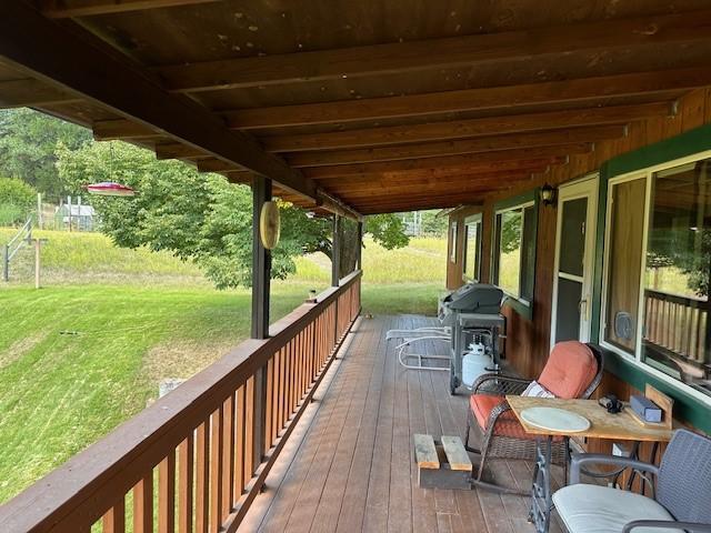 708 Johnson Ln, Superior, MT 59872 - wooden deck with area for grilling and a yard