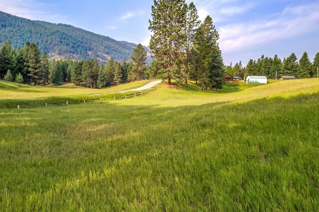 708 Johnson Ln, Superior, MT 59872 - view of home's community with a mountain view, a rural view, and a wooded view