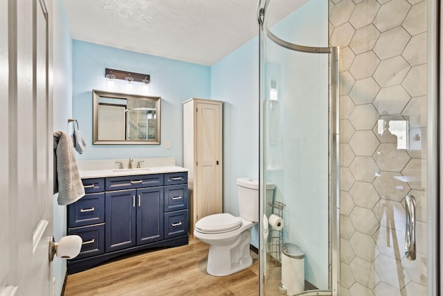 32306 St Ignatius Airport Rd, Saint Ignatius, MT 59865 - full bath featuring wood finished floors, a stall shower, and vanity