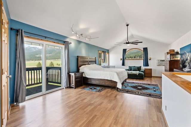 32306 St Ignatius Airport Rd, Saint Ignatius, MT 59865 - bedroom with access to exterior, wood finished floors, vaulted ceiling, and ceiling fan