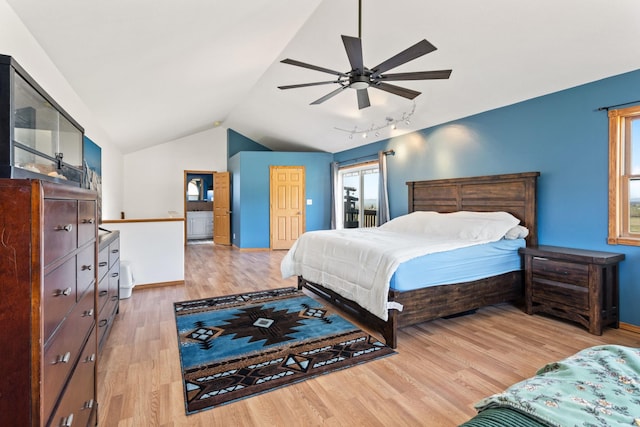 32306 St Ignatius Airport Rd, Saint Ignatius, MT 59865 - bedroom featuring light wood-type flooring, track lighting, multiple windows, vaulted ceiling, and ceiling fan
