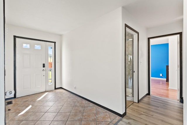32306 St Ignatius Airport Rd, Saint Ignatius, MT 59865 - foyer entrance featuring baseboards and light wood-style flooring