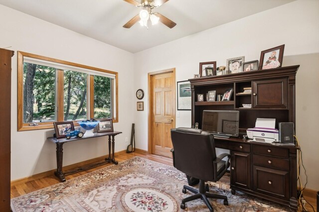 196 Pine Needle Ln, Bigfork, MT 59911 - office with a ceiling fan and wood finished floors