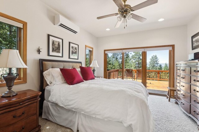 196 Pine Needle Ln, Bigfork, MT 59911 - bedroom with an AC wall unit, access to exterior, recessed lighting, and ceiling fan
