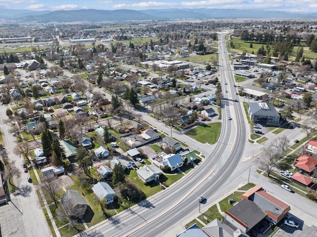 drone / aerial view featuring a residential view and a mountain view
