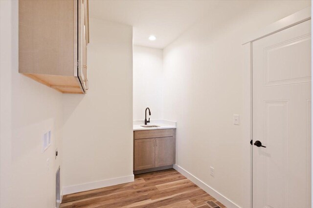 bedroom with baseboards, a closet, and carpet