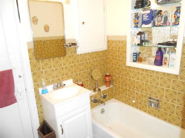 1426 2nd Ave NW, Great Falls, MT 59404 - bathroom with tile walls, wainscoting, a bath, and vanity
